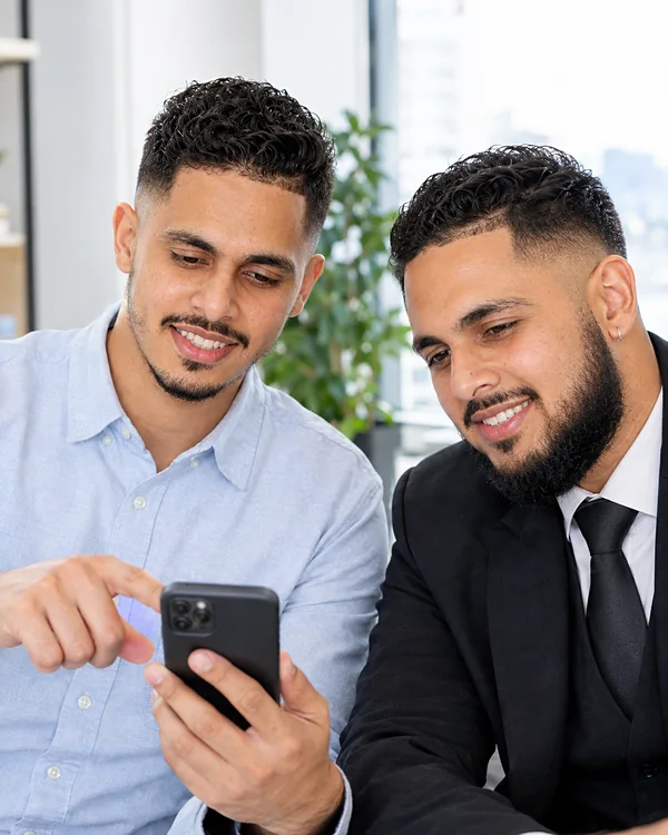 Sukhveer and Arshdeep testing the app on a phone
